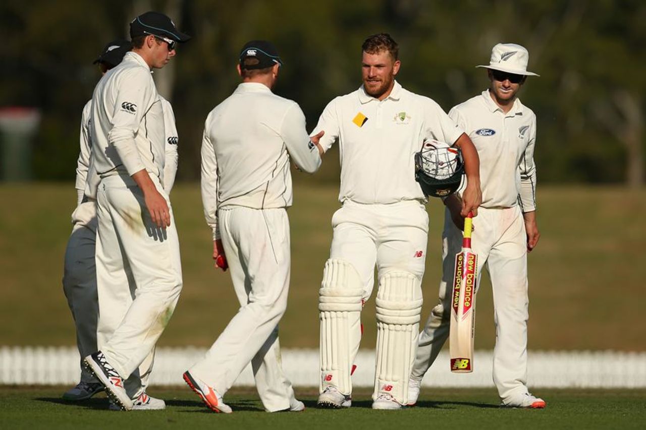 The New Zealanders congratulate Aaron Finch on finishing the day unbeaten on 214, Cricket Australia XI v New Zealand, Sydney, 1st day, October 29, 2015