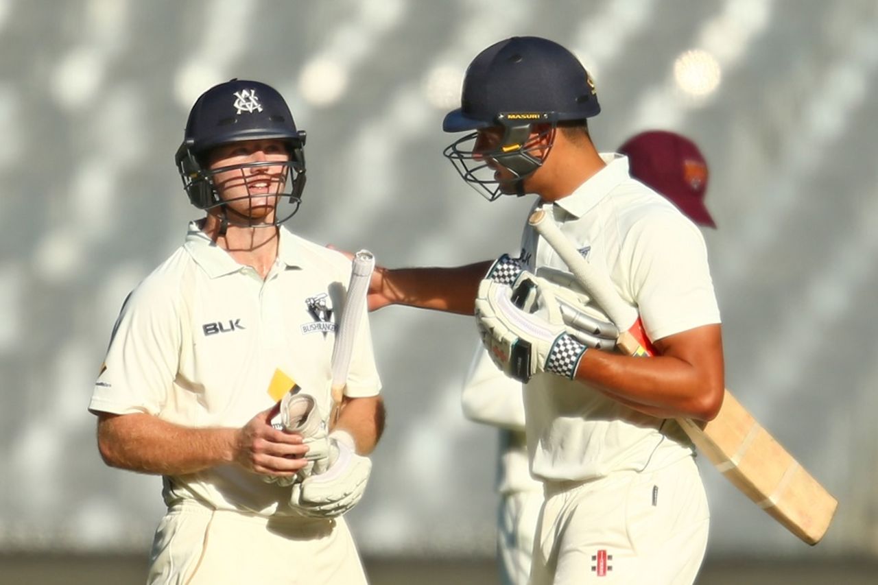 Travis Dean is congratulated by Marcus Stoinis after he hit the winning runs, Victoria v Queensland, Sheffield Shield, Melbourne, 4th day, October 31, 2015