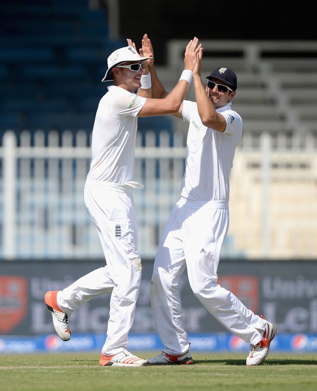 Stuart Broad  and Alastair Cook celebrate the wicket of Mohammad Hafeez, Pakistan v England, third Test, Sharjah, 1st day, November 1, 2015