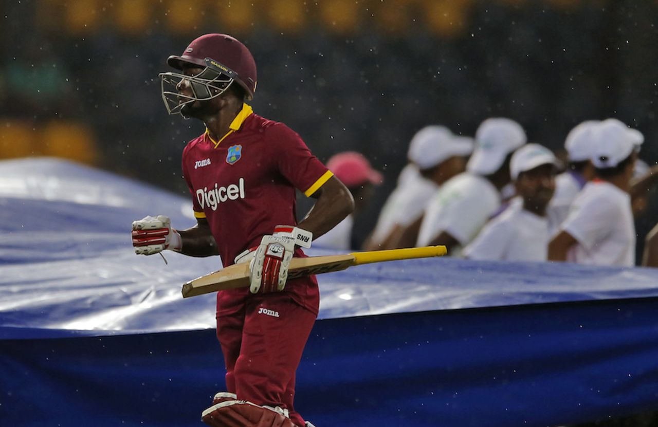 Jonathan Carter walks off the field as rain interrupts play, Sri Lanka v West Indies, 1st ODI, Colombo, November 1, 2015 