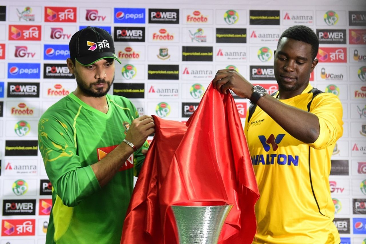 Mashrafe Mortaza and Elton Chigumbura unveil the trophy, Dhaka, November 6, 2015