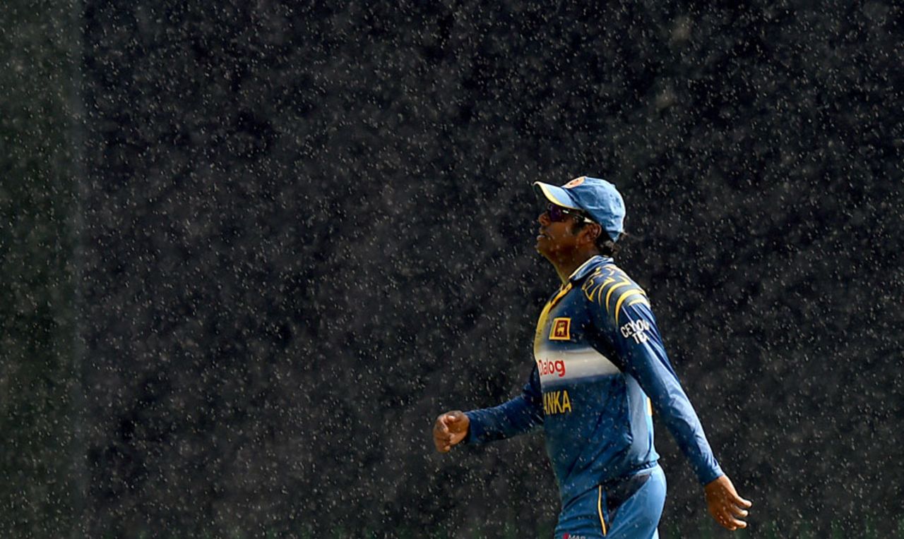 Angelo Mathews walks off in the rain, Sri Lanka v West Indies, 3rd ODI, Pallekele, November 7, 2015
