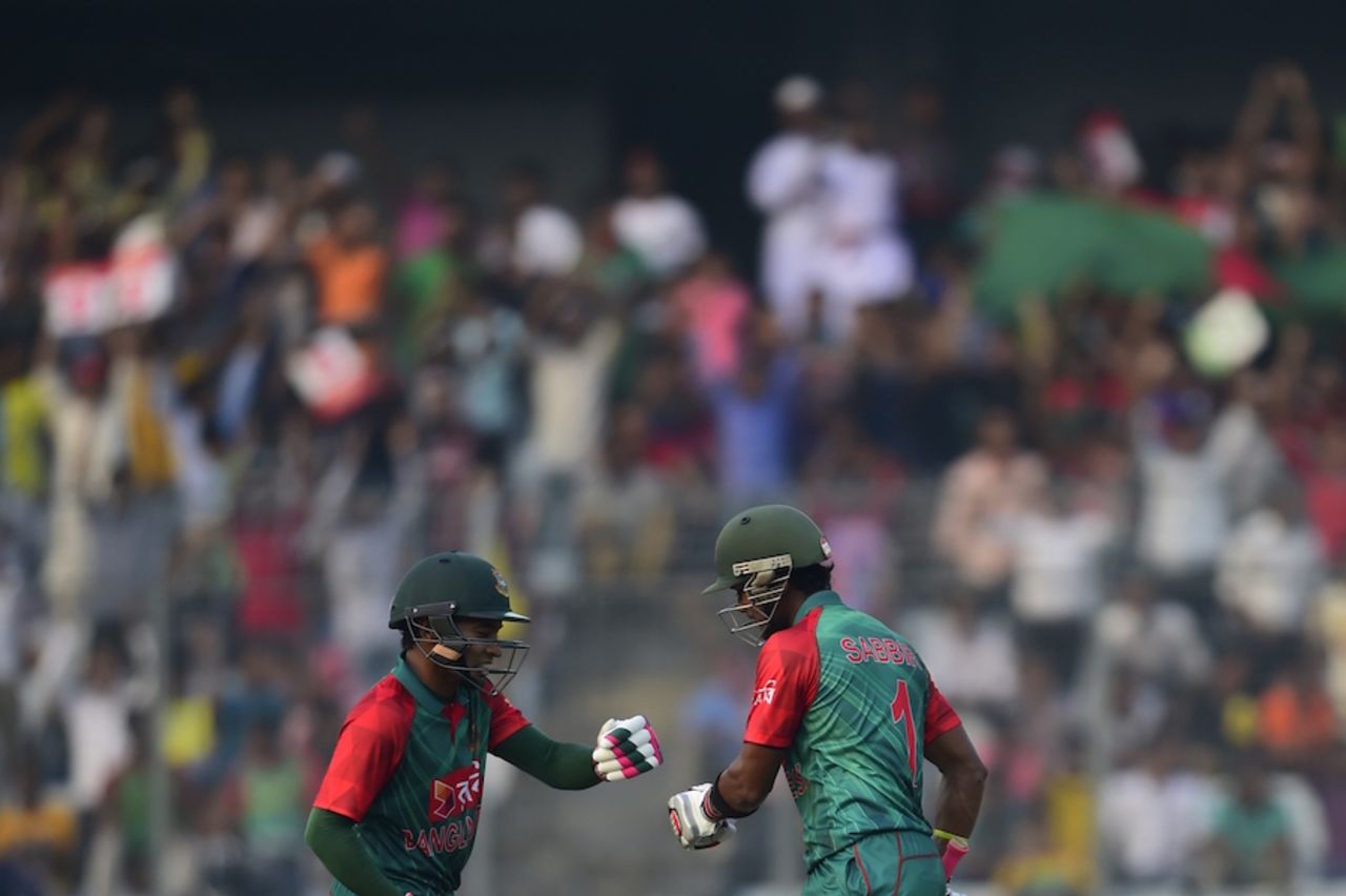 Mushfiqur Rahim and Sabbir Rahman touch gloves during their 119-run partnership, Bangladesh v Zimbabwe, 1st ODI, Mirpur, November 7, 2015