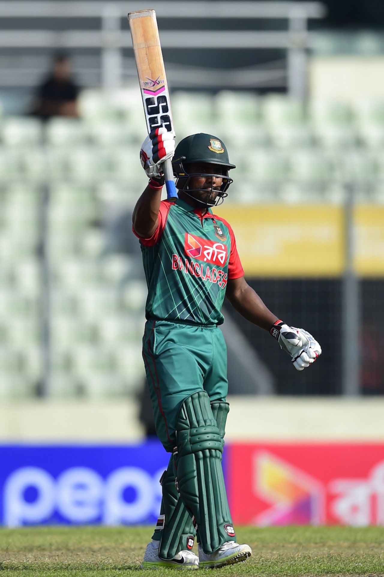 Imrul Kayes raises his bat after completing his second successive fifty, Bangladesh v Zimbabwe, 3rd ODI, Mirpur, November 11, 2015