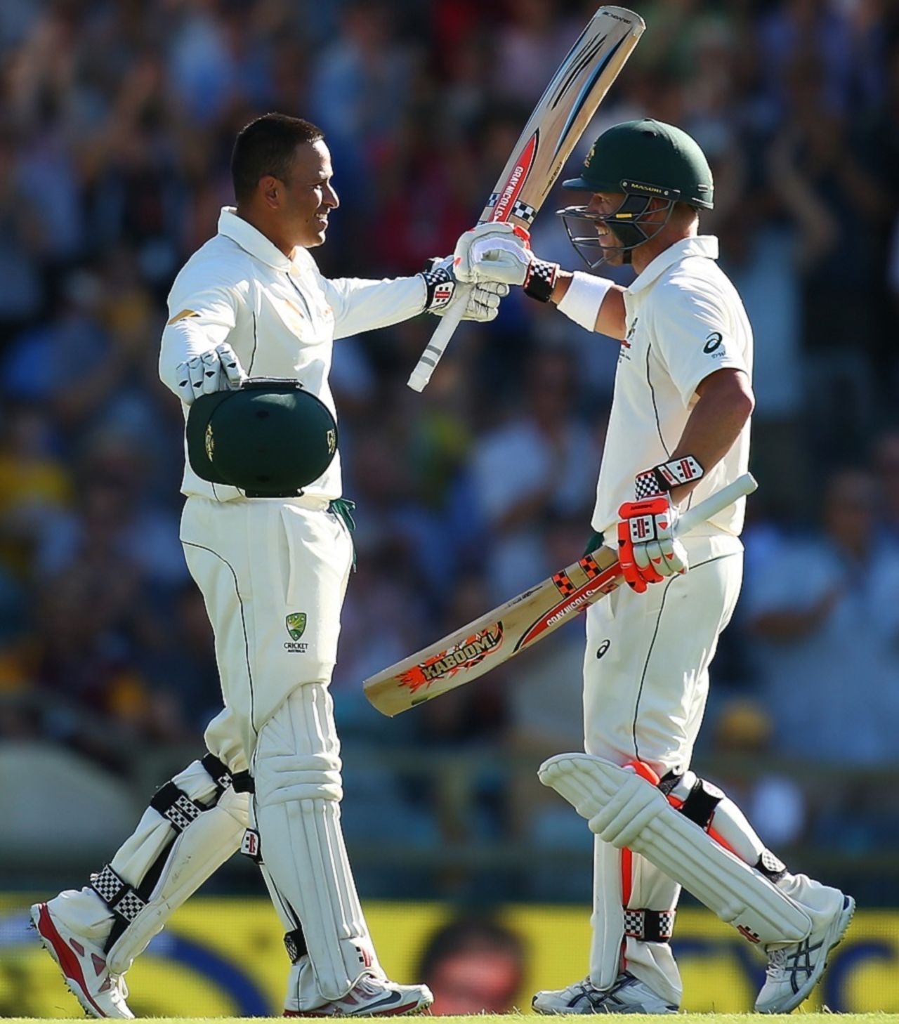 Usman Khawaja is congratulated by David Warner after he completed his ton, Australia v New Zealand, 2nd Test, Perth, 1st day, November 13, 2015