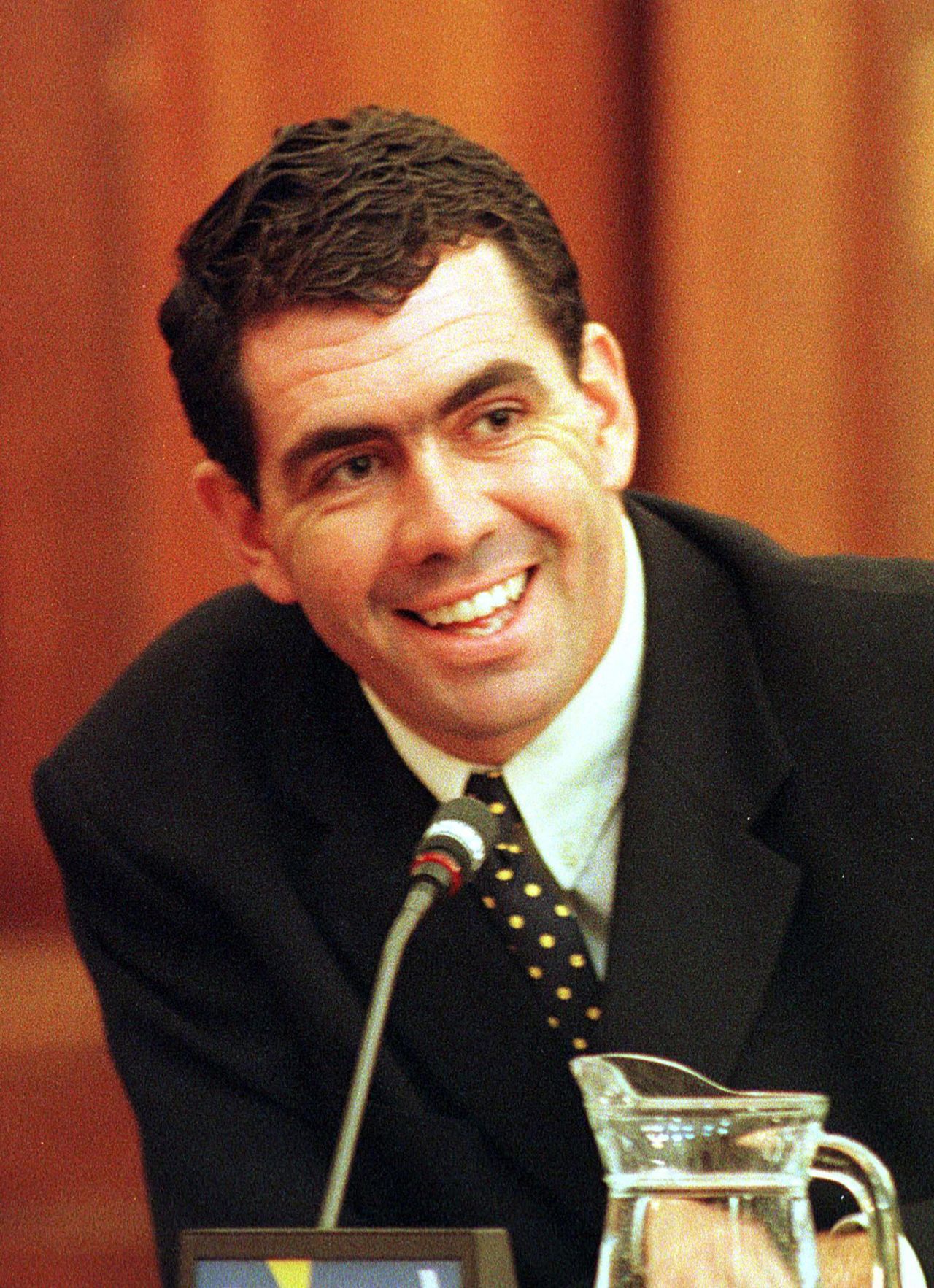 Sacked South African cricket captain Hansie Cronje smiles during his cross-examination at the King Commission of Inquiry into allegations of cricket match-fixing in Cape Town 23 June 2000. Hansie Cronje told the third day of cross-examination here that other players could be involved in match-fixing.