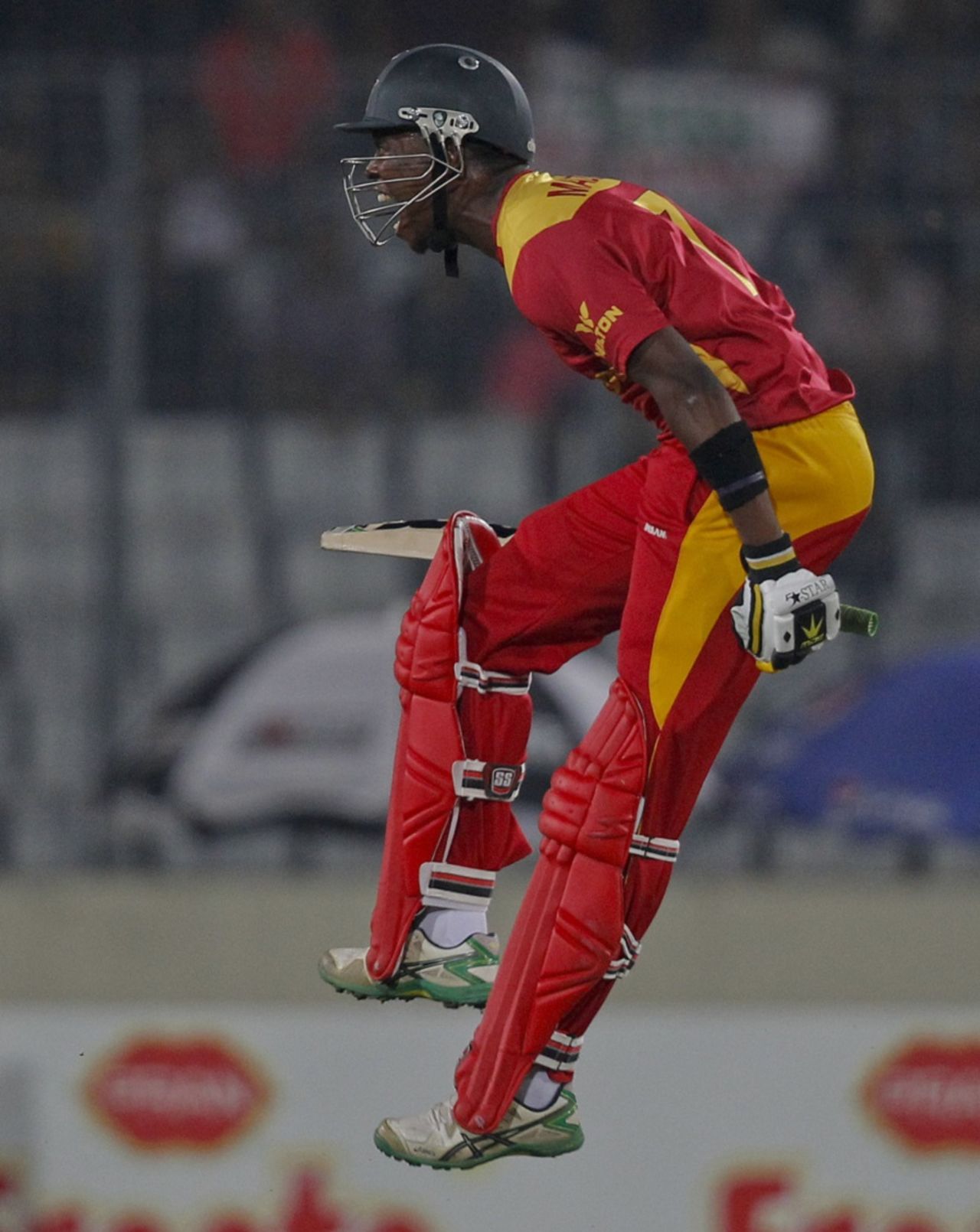 Neville Madziva leaps in joy after hitting the winning runs, Bangladesh v Zimbabwe, 2nd T20I, Dhaka, November 15, 2015