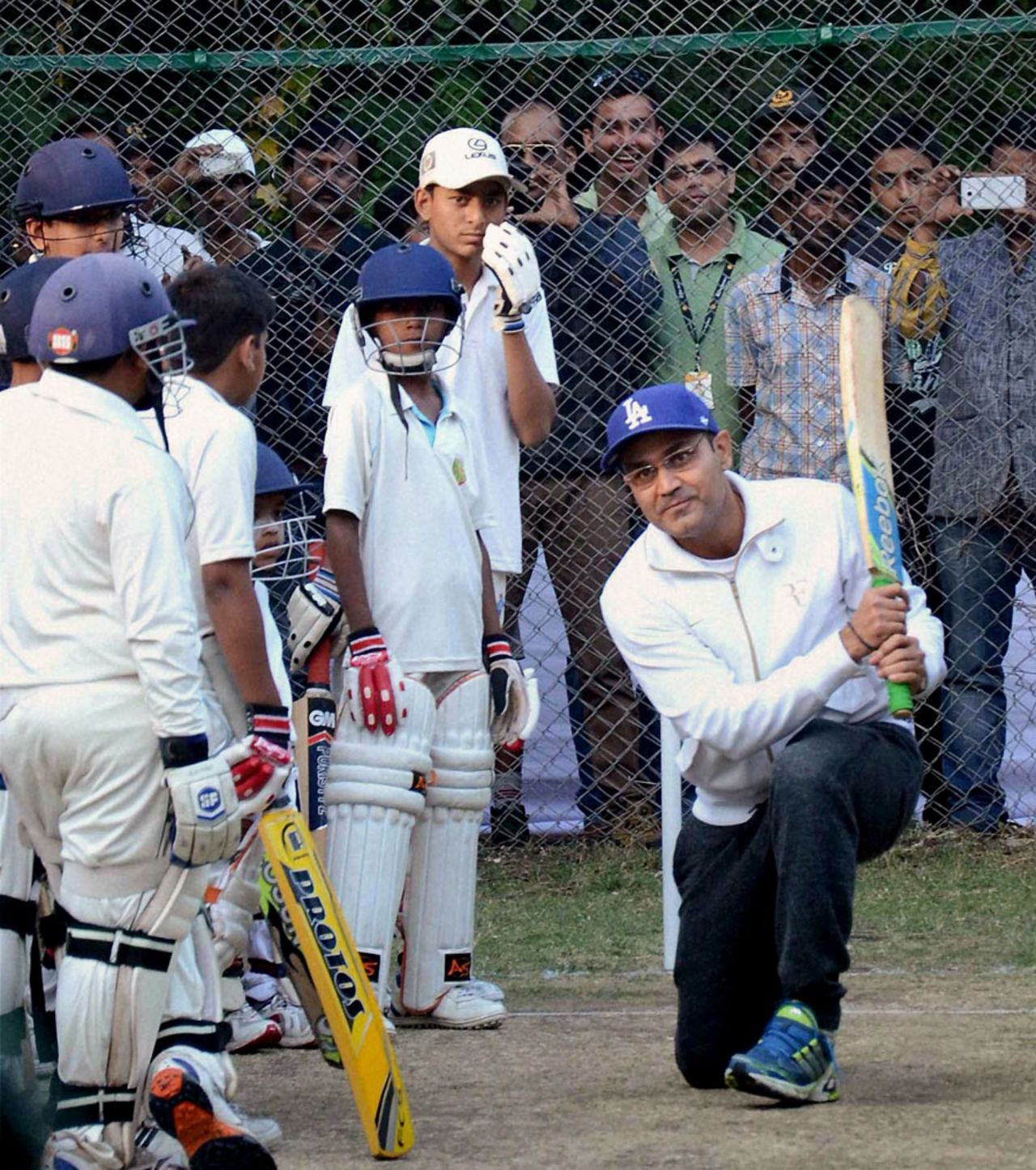Virender Sehwag with kids at a batting clinic in Bhopal, November 21, 2015