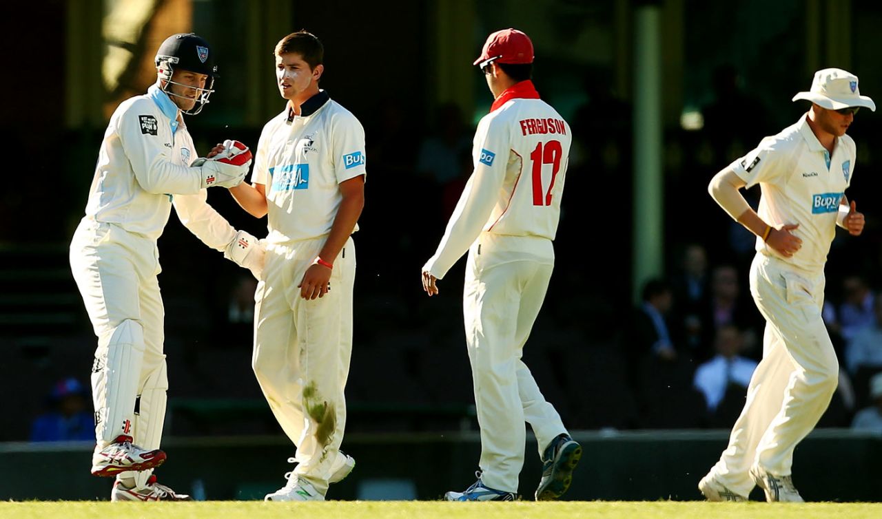 James Muirhead is congratulated for taking the wicket of Ian Bell, Cricket Australia Invitational XI v England, Sydney, 2nd day, November 14, 2013
