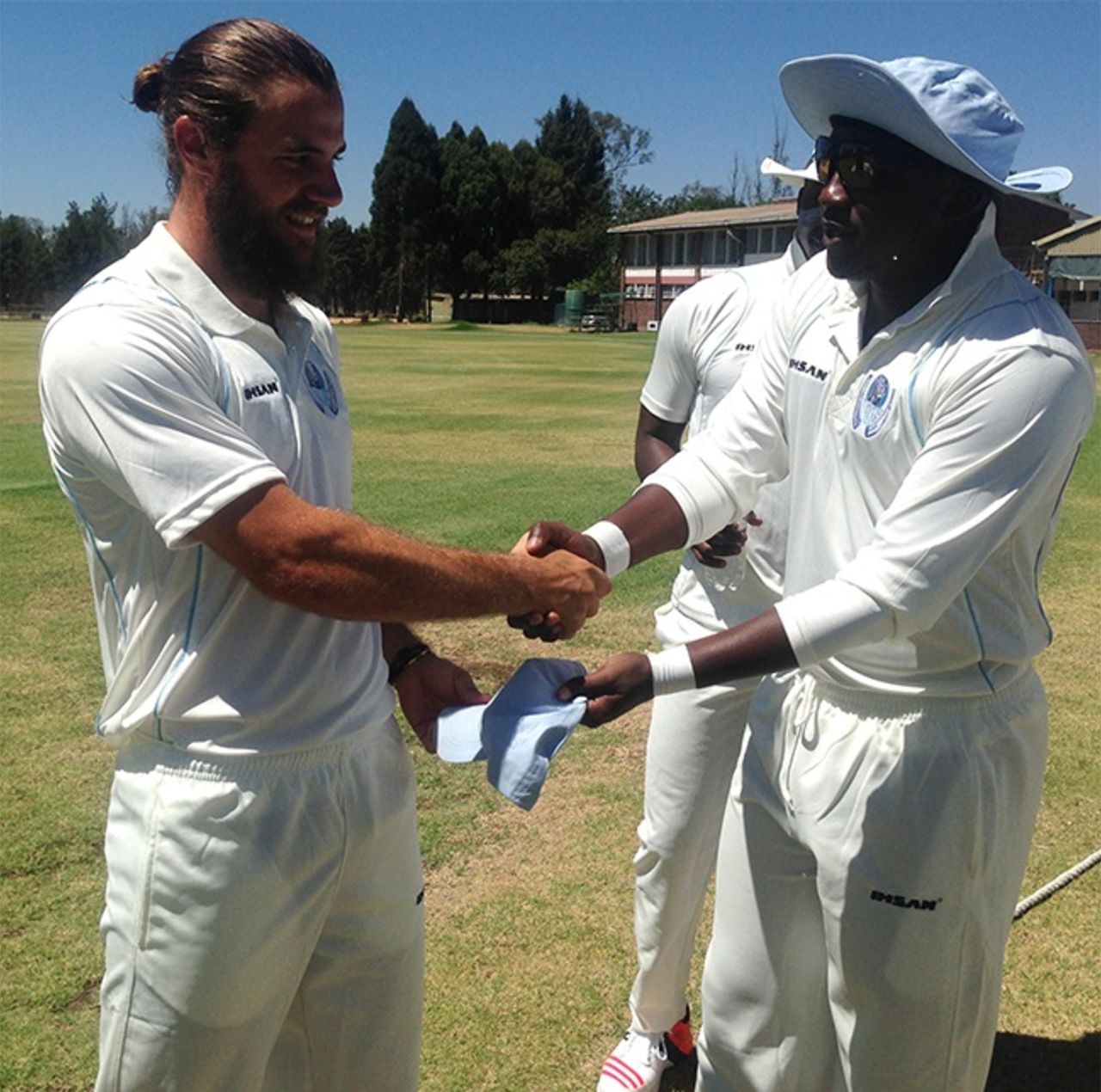 Kyle Bowie is presented his cap on first-class debut for Matabeleland Tuskers,  Mashonaland Eagles v Matabeleland Tuskers, Logan Cup, Harare, 1st day November 25 2015