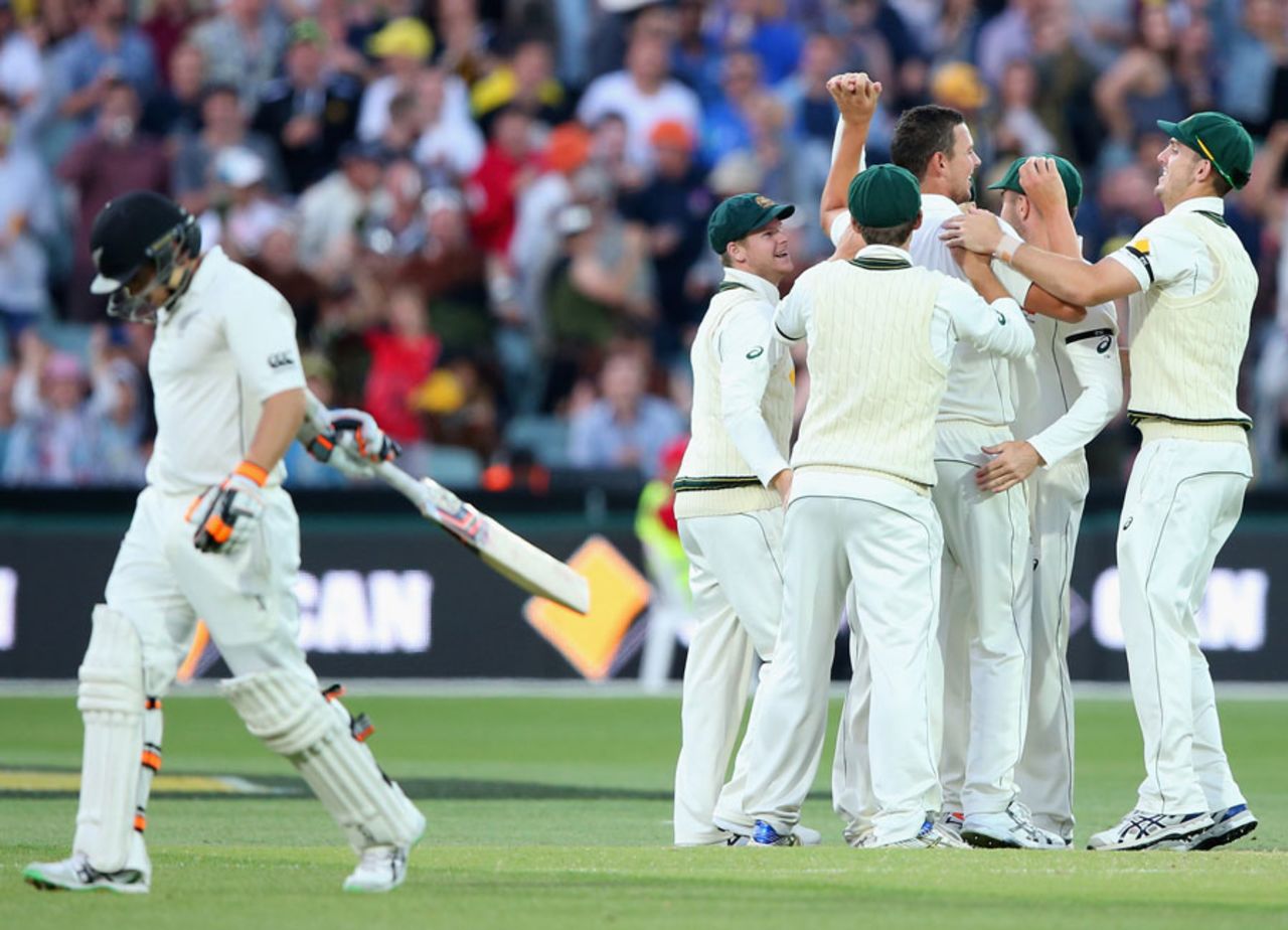 Josh Hazlewood is mobbed by his team-mates after claiming the wicket of Tom Latham, Australia v New Zealand, 3rd Test, Adelaide, 2nd day, November 28, 2015