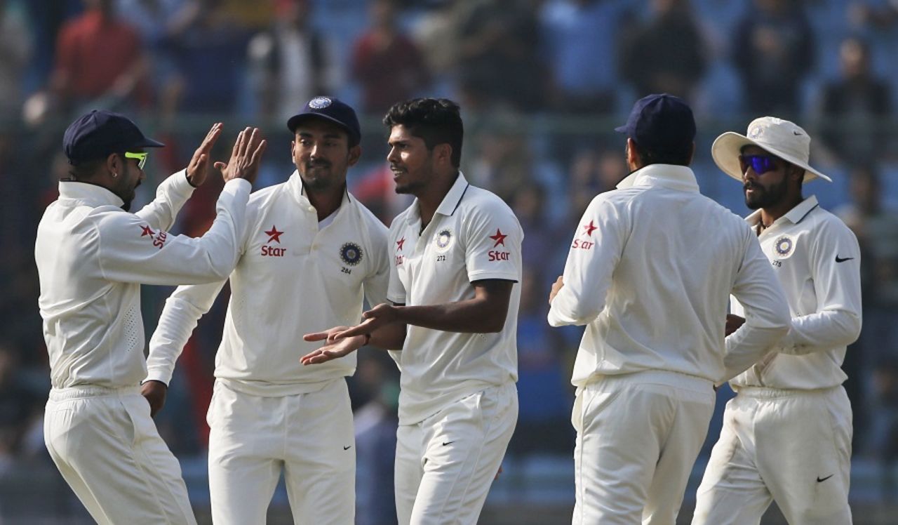 Umesh Yadav is mobbed by his team-mates, India v South Africa, 4th Test, Delhi, 2nd day, December 4, 2015