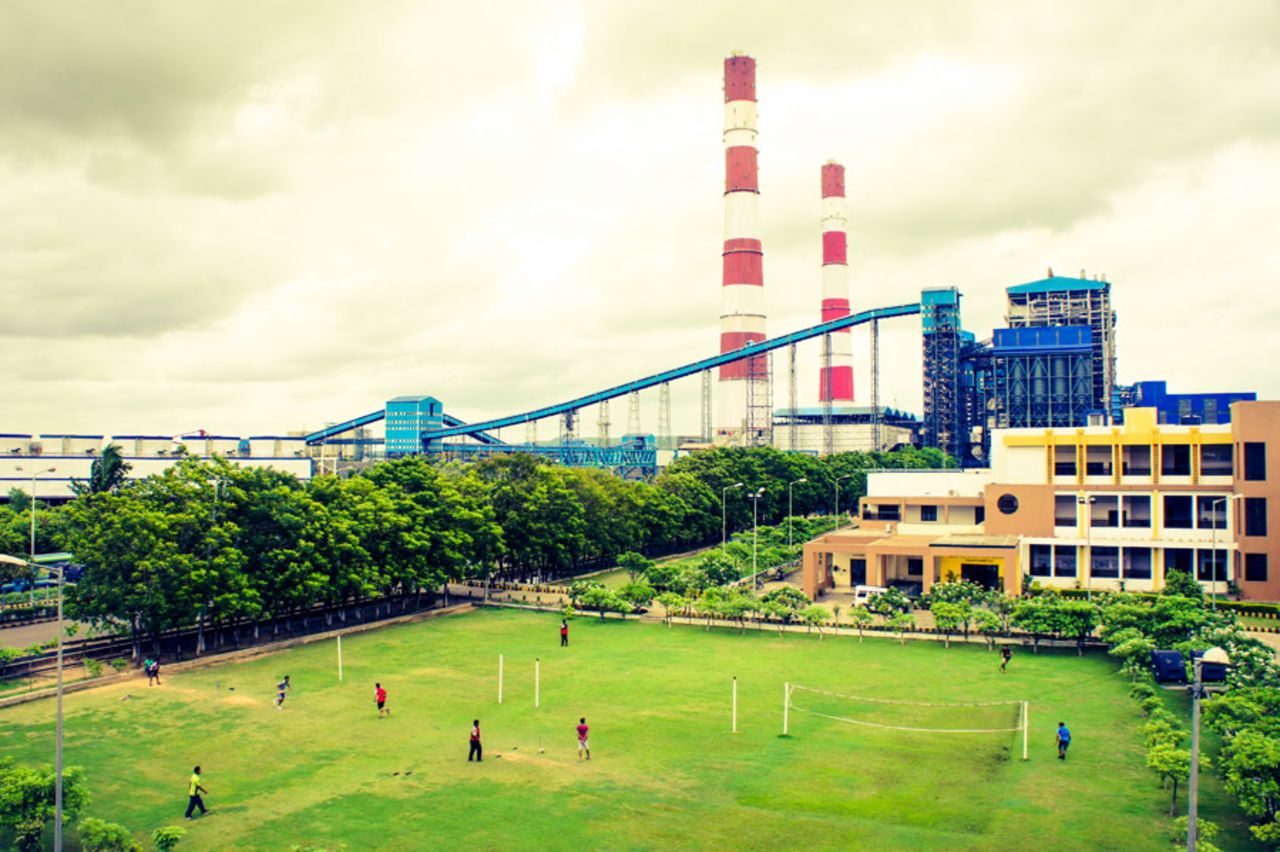 <b>Razzaq Siddiqui:</b> Cricket at OP Jindal Power Station complex in Tamnar, Chhattisgarh, India. There is a Power Technology Institute inside the complex and these were its students playing a game of cricket on a sunny Sunday. Immediately after taking this pic a safety valve popped in the plant creating a loud noise. This halted play as these young to be power engineers discussed what could be the reason. Then a few minutes later play resumed.