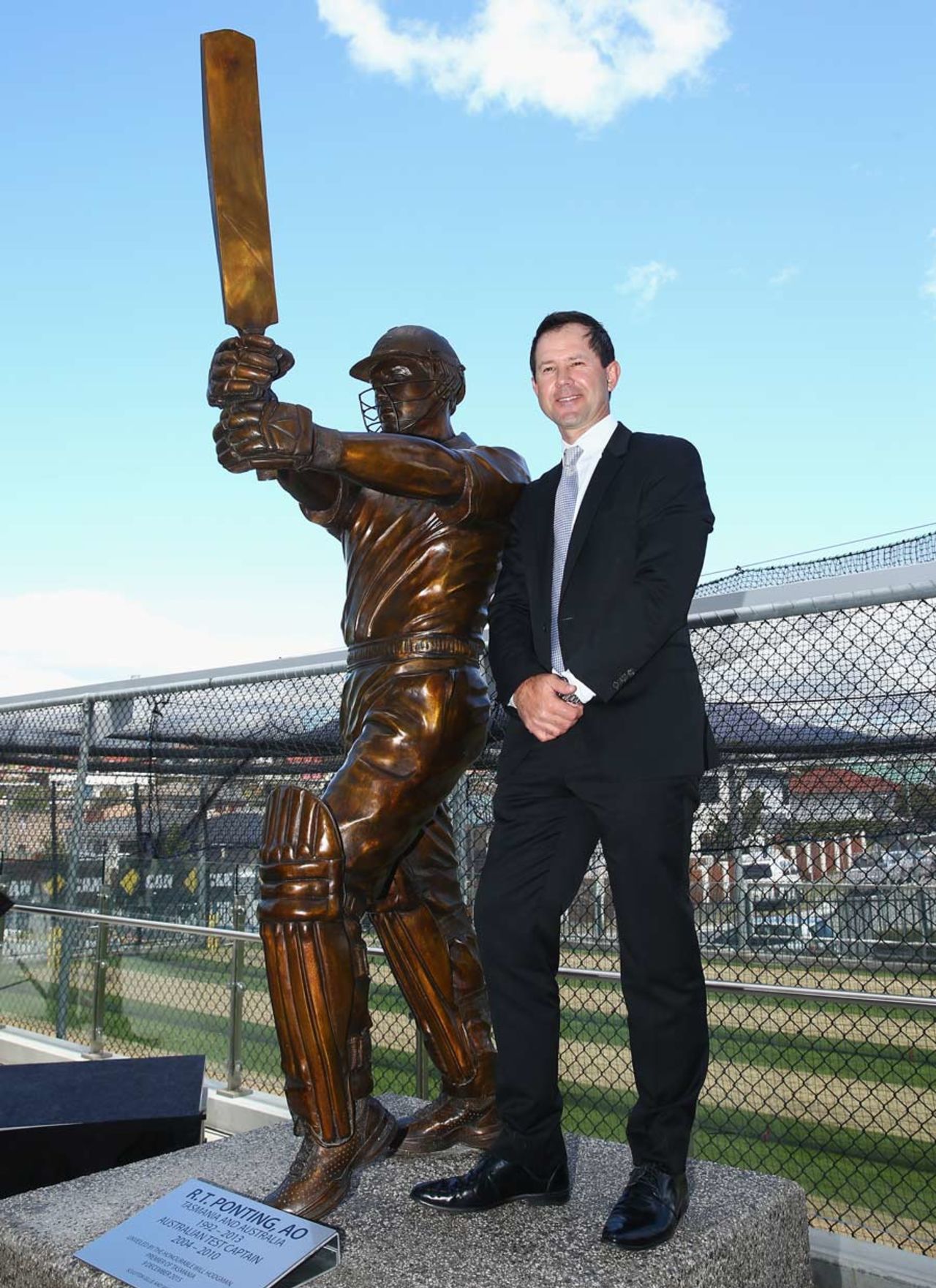 Ricky Ponting poses beside a statue of himself at the Bellerive Oval, Hobart, December 9, 2015