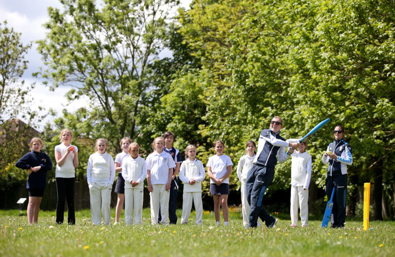 A group of girls watch Heather Knight bat at a Chance to Shine event, Chelmsford, May 19, 2015