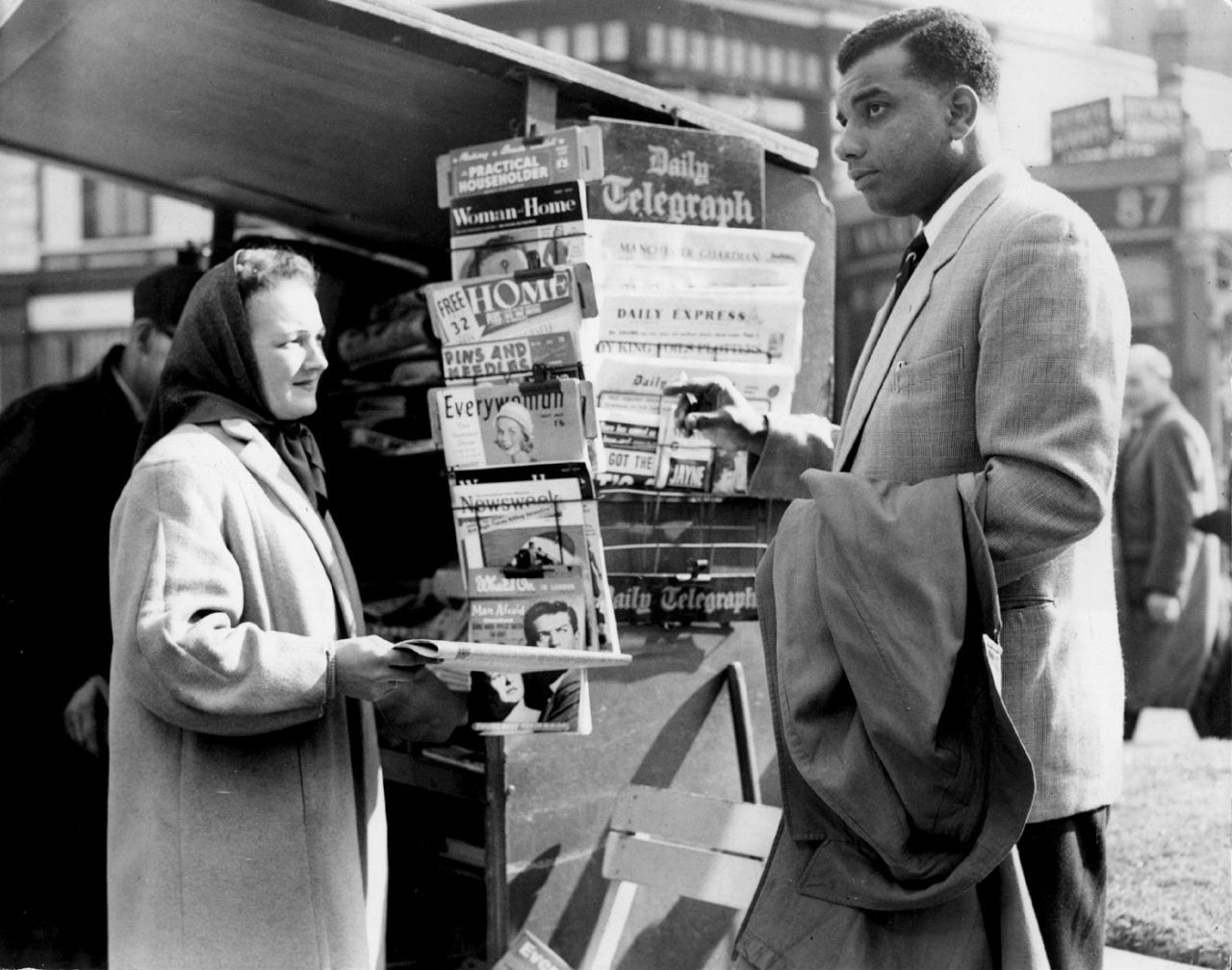 Clyde Walcott buys a morning newspaper, April 15, 1957