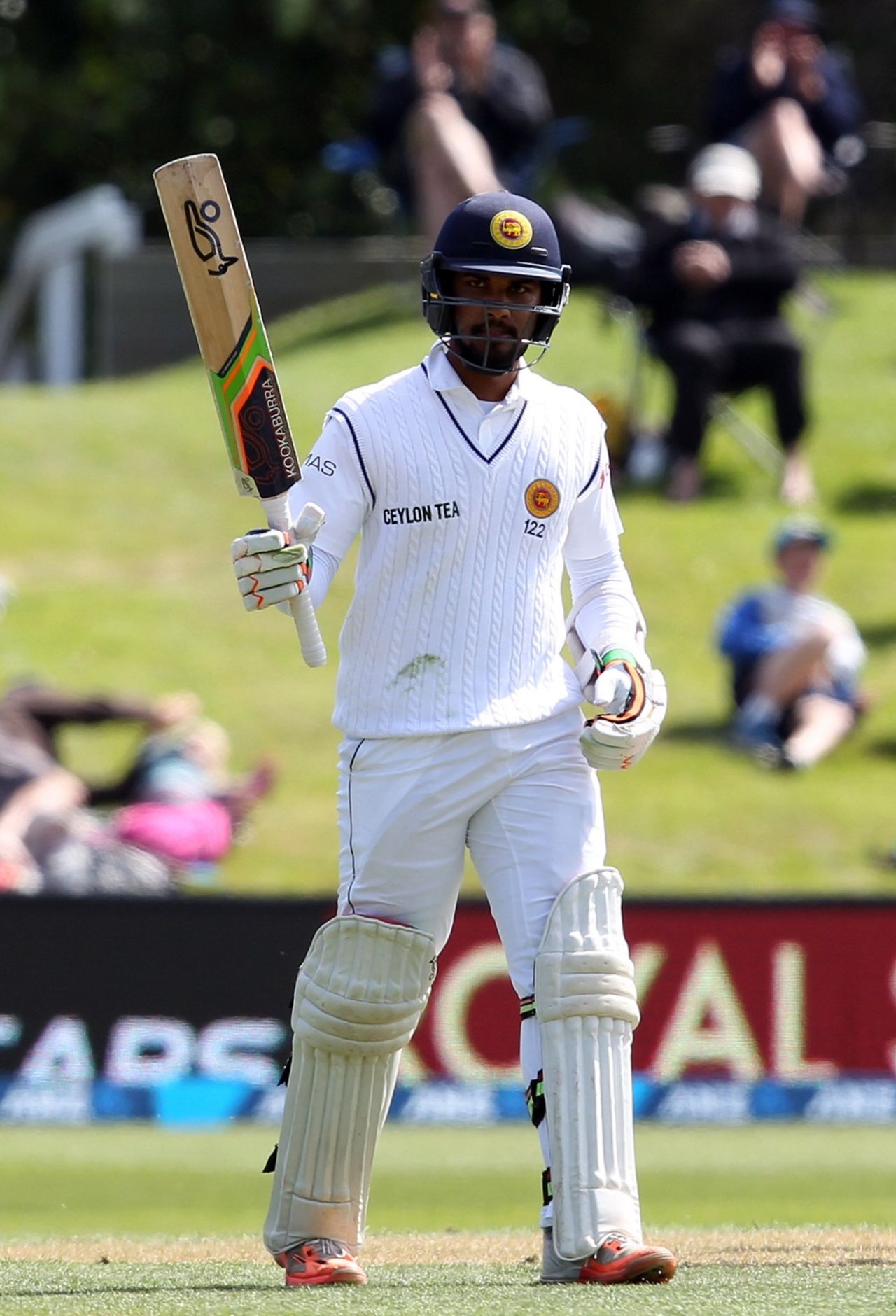 Dinesh Chandimal raises his bat after reaching his fifty, New Zealand v Sri Lanka, 1st Test, Dunedin, 2nd day, December 11, 2015