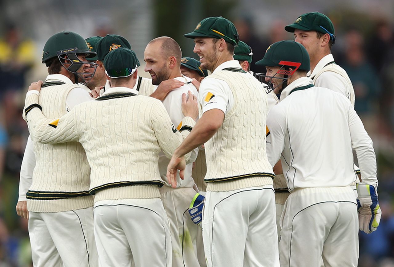 Team-mates mob Nathan Lyon after he dismissed Jermaine Blackwood, Australia v West Indies, 1st Test, Hobart, 2nd day, December 11, 2015