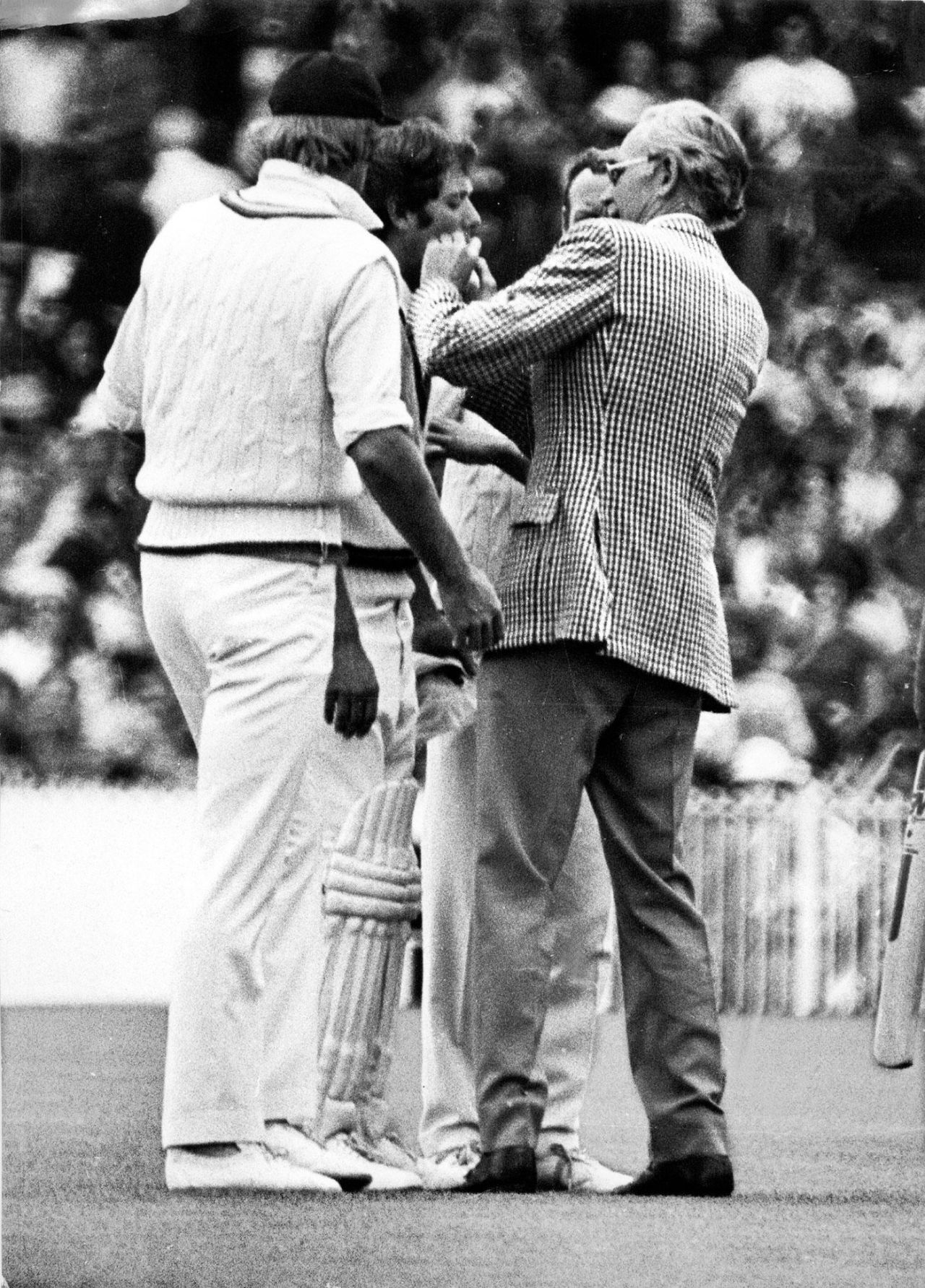 Rick McCosker is tended to by a doctor after he was hit in the face, Australia v England, Centenary Test, first day, Melbourne, March 1977