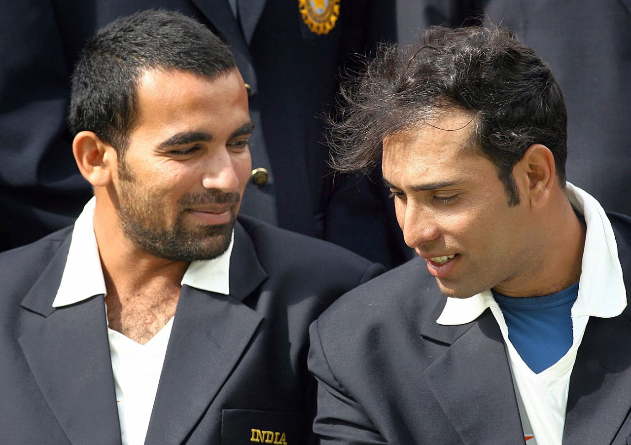Zaheer Khan and VVS Laxman chat as the pose for a group photo, July 17, 2007
