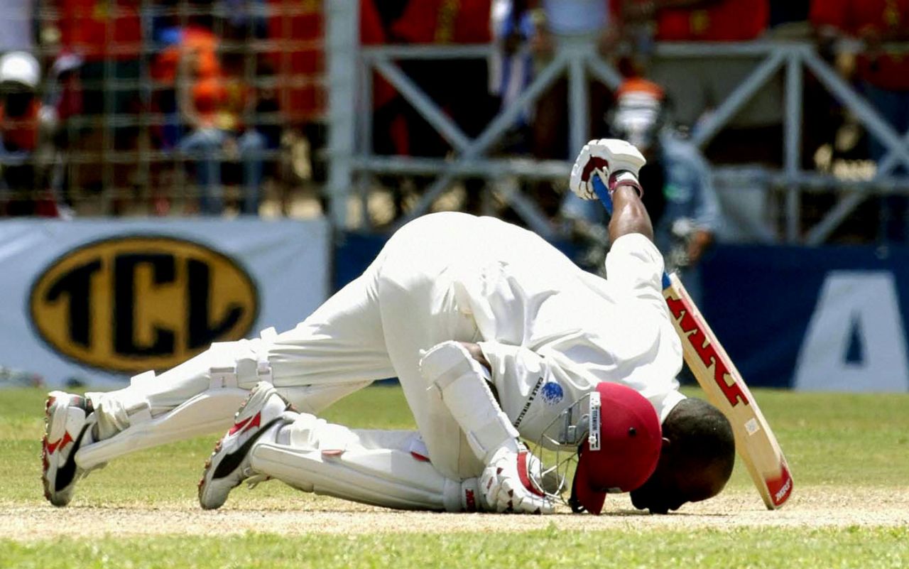 Brian Lara kisses the pitch after passing Matthew Hayden's record, West Indies v England, Antigua, April 12, 2004