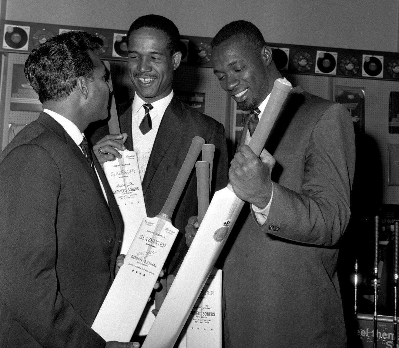 Rohan Kanhai, Garry Sobers and Wes Hall inspect bats at the Slazenger store in Croydon, April 18, 1966