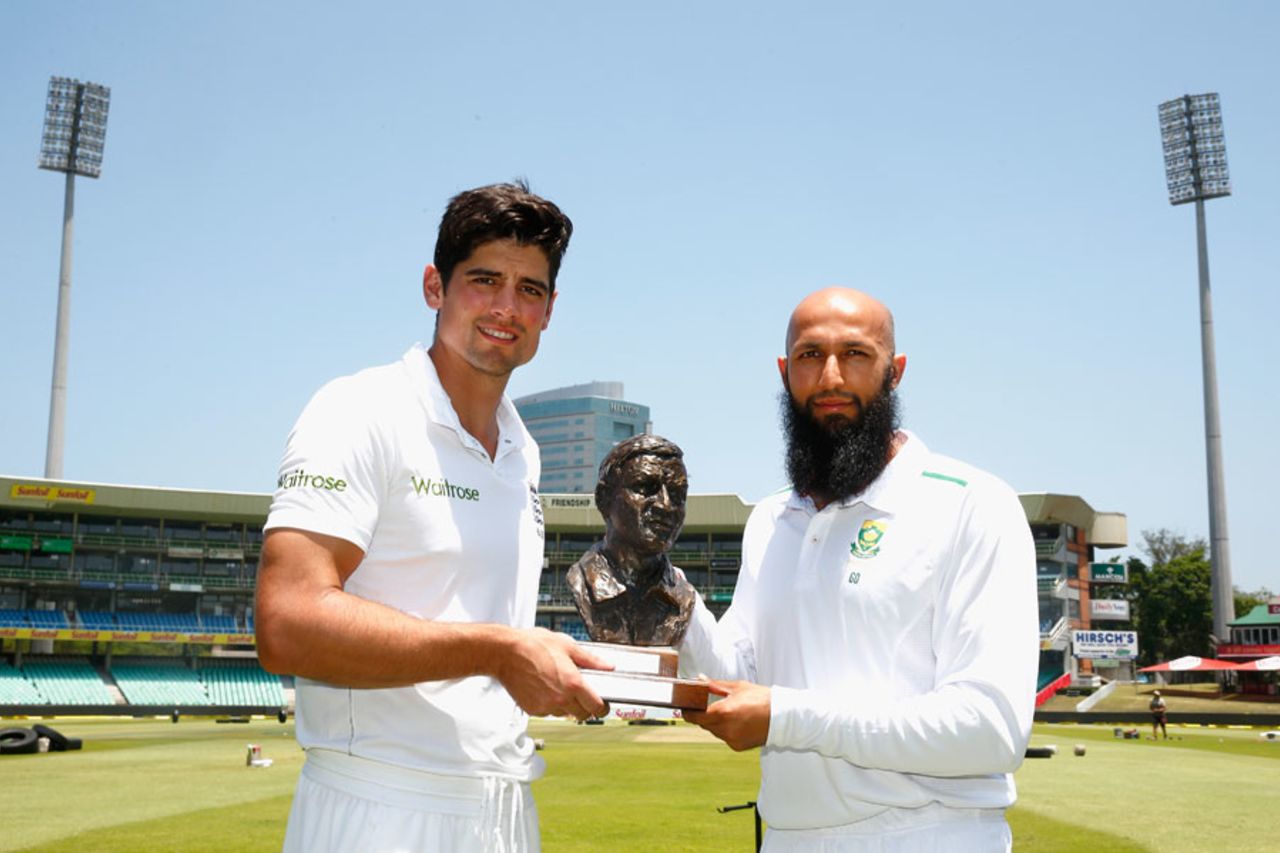 Hashim Amla and Alastair Cook pose with the Basil D'Oliveira Trophy, Durban, December 24, 2015