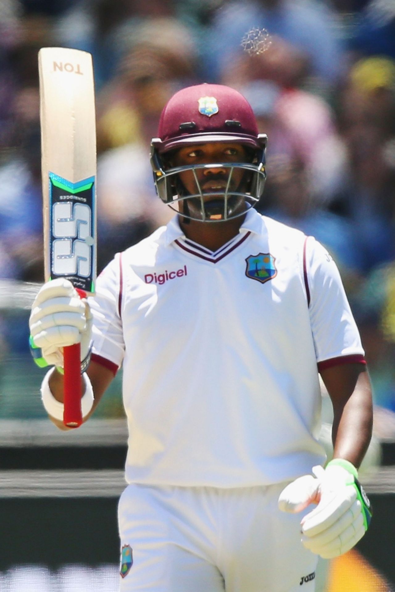 Darren Bravo raises his bat after reaching his fifty, Australia v West Indies, 2nd Test, Melbourne, 3rd day, December 28, 2015