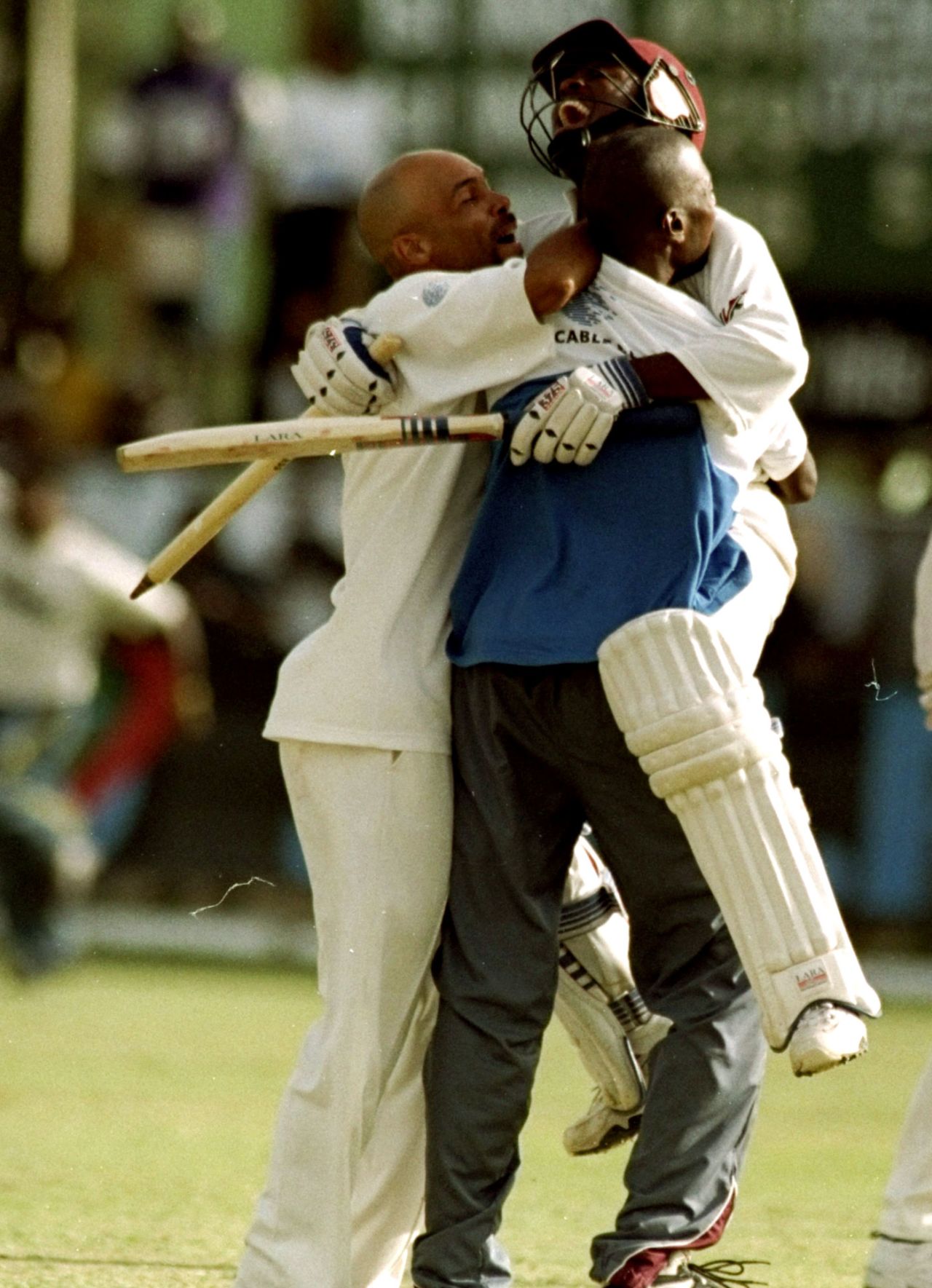 Brian Lara is embraced by his team-mates after the win, West Indies v Australia, 3rd Test, Barbados, 5th day, March 30, 1999