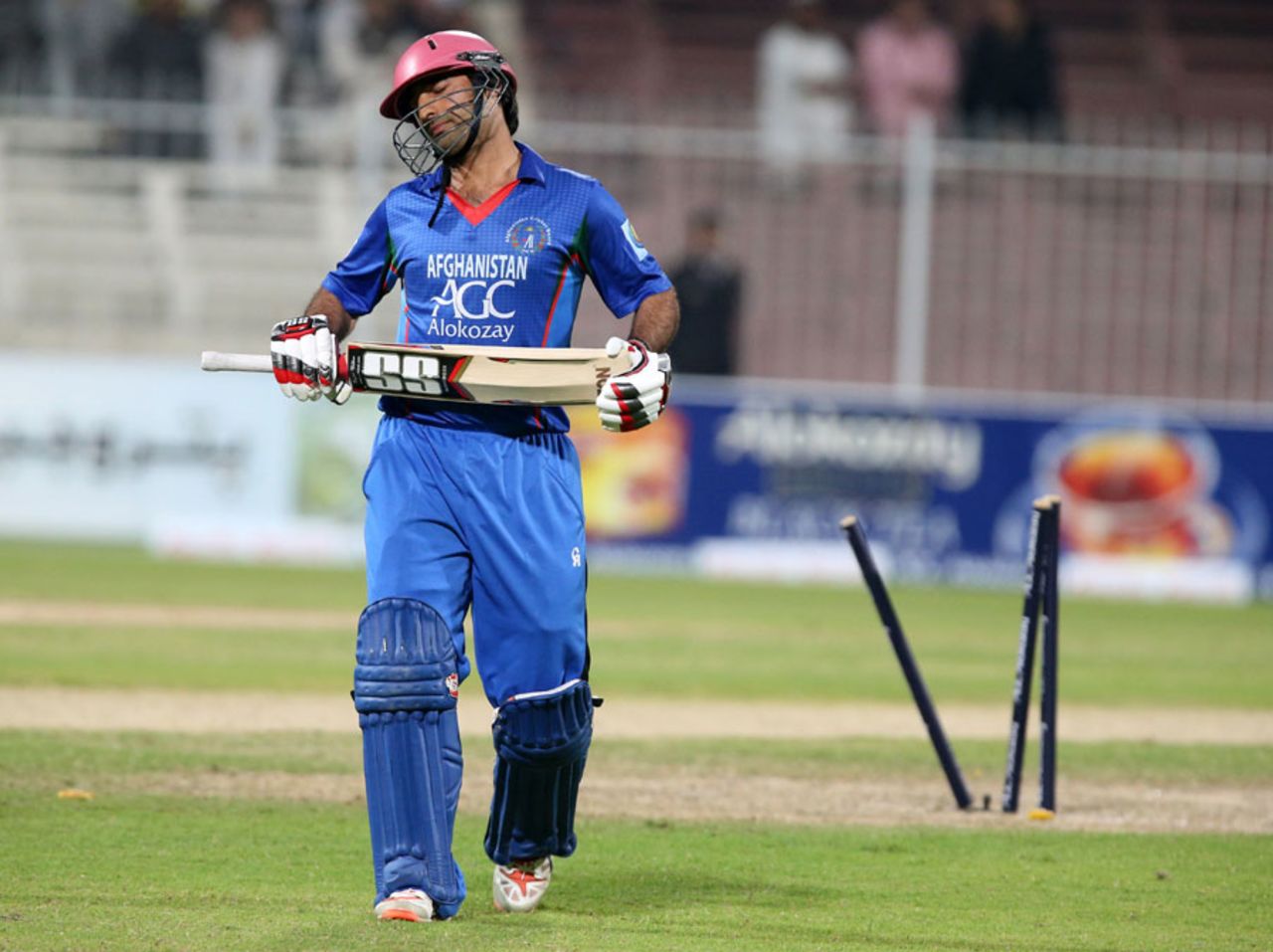 Asghar Stanikzai walks off after chopping one onto his stumps, Afghanistan v Zimbabwe, 2nd ODI, Sharjah, December 29, 2015