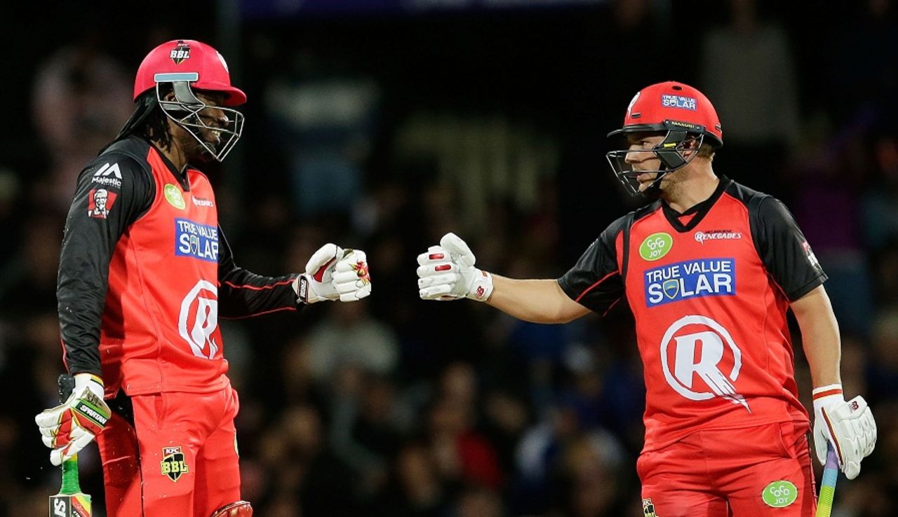 Aaron Finch and Chris Gayle touch gloves during their 84-run stand, Hobart Hurricans v Melbourne Renegades, BBL 2015-16, Hobart, January 4, 2016