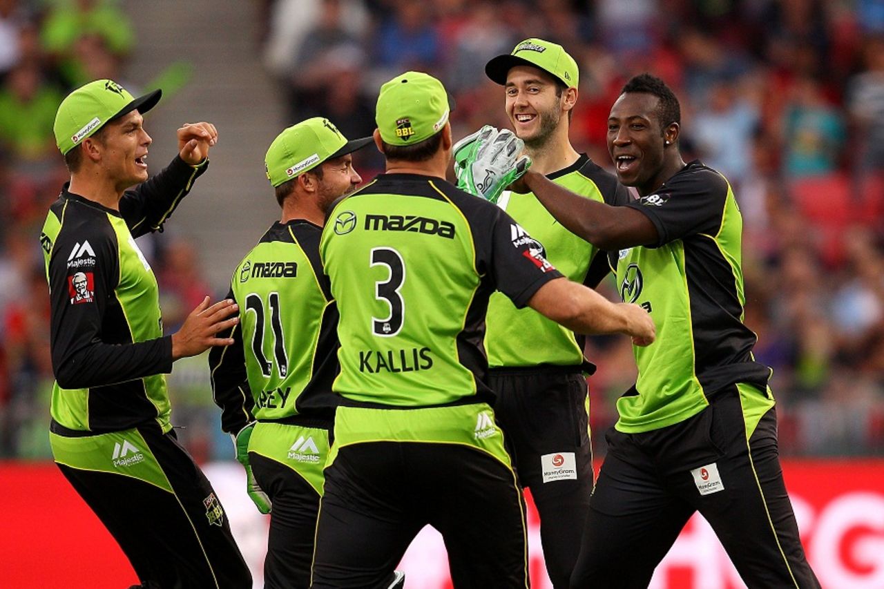 Andre Russell celebrates the wicket of Michael Klinger with his team-mates, Sydney Thunder v Perth Scorchers, BBL 2015-16, Sydney, January 7 2016