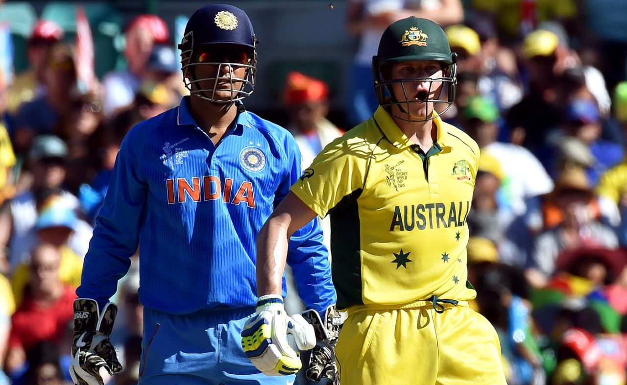 Steven Smith calls his team-mate while MS Dhoni looks on, Australia v India, World Cup 2015, 2nd semi-final, Sydney, March 26, 2015