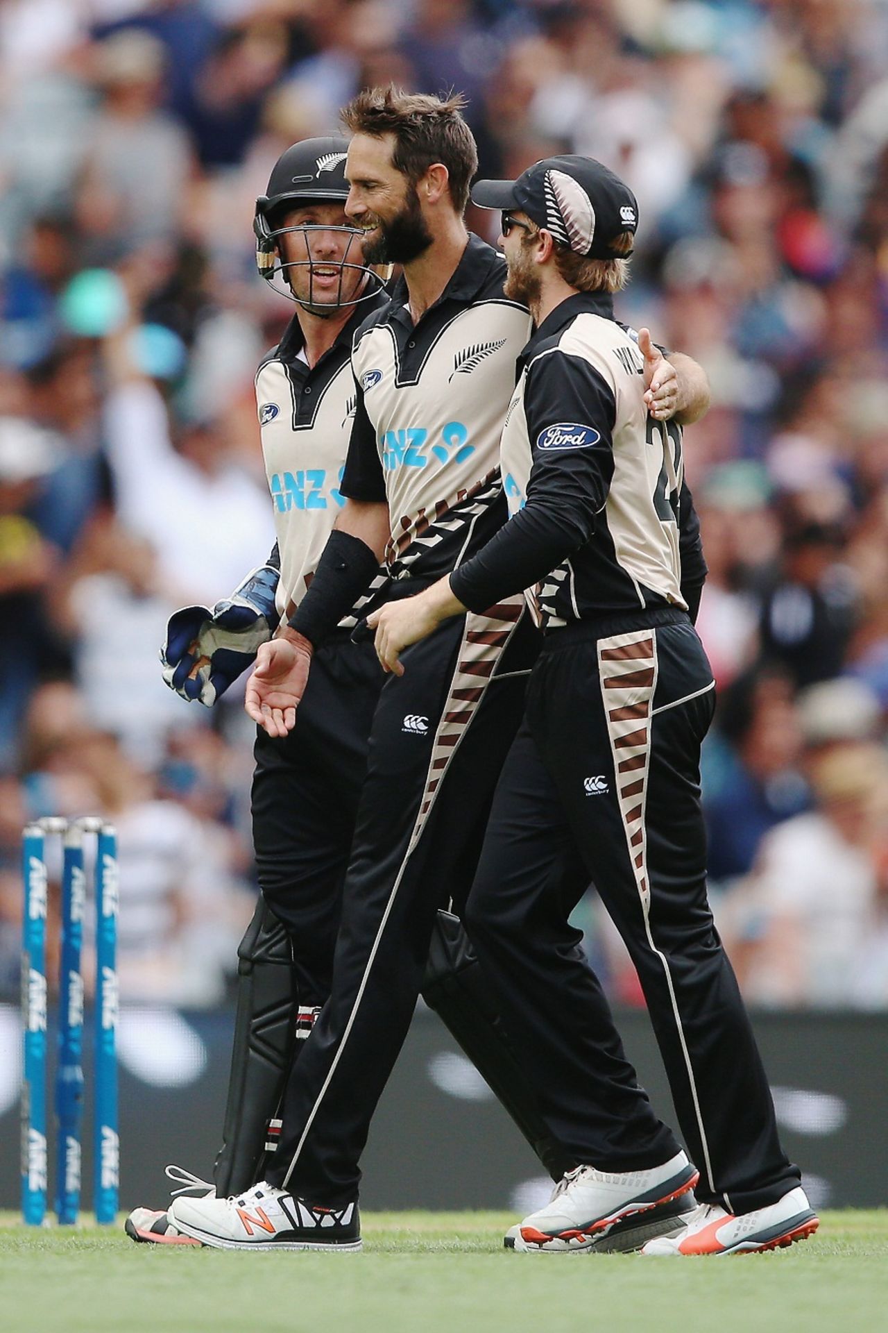Grant Elliott celebrates a wicket with Kane Williamson and Luke Ronchi, New Zealand v Sri Lanka, 2nd T20I, Auckland, January 10, 2016