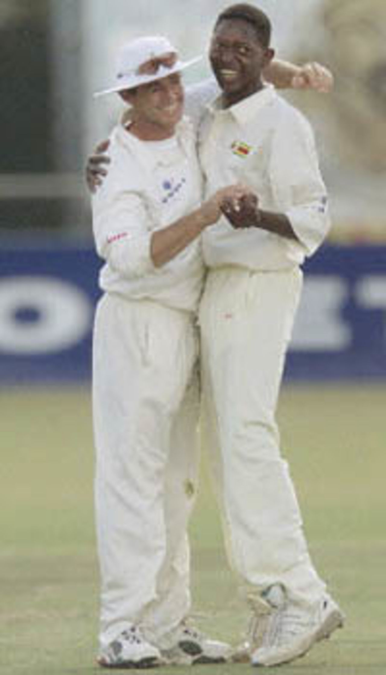 Brighton Watambwa and Guy Whittall celebrate the wicket of Javagal Srinath, 1st Test, Zimbabwe v India, Queens Sports Club, Bulawayo,  June 8, 2001