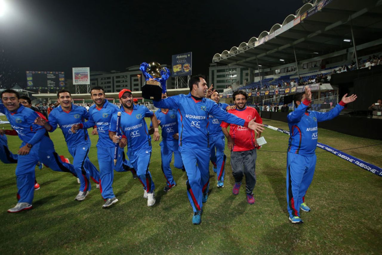 The victorious Afghanistan team celebrate with a lap around the ground, Afghanistan v Zimbabwe, 2nd T20I, Sharjah, January 10, 2016