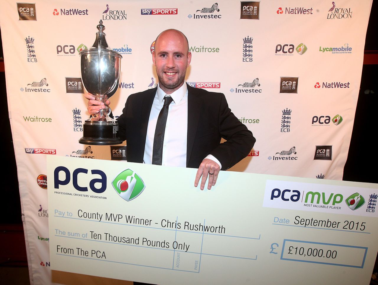 Chris Rushworth, the PCA Player of the Year, holds up the Reg Hayter Cup, London, September 29, 2015  29