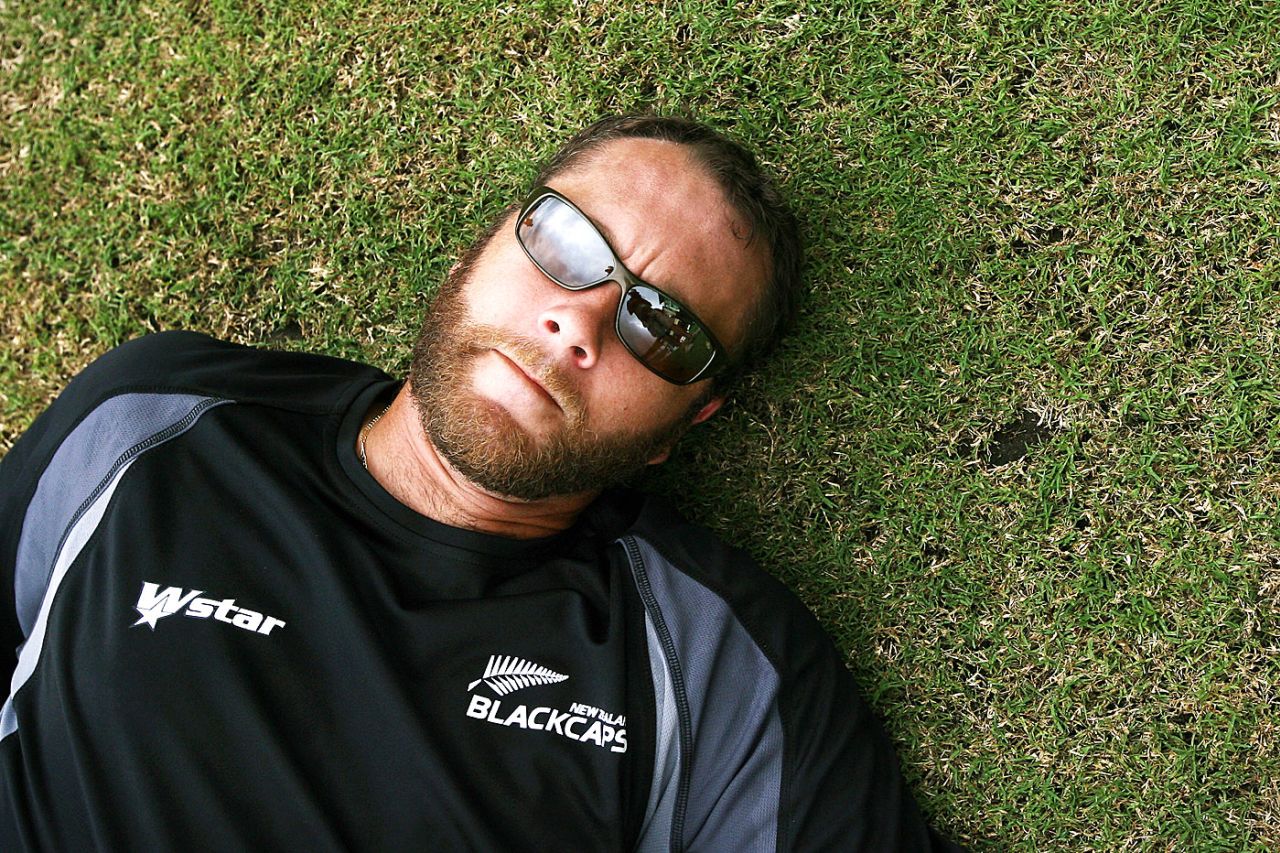 That's it for me boys: Craig McMillan lies down on the grass during practice, Guyana, April 5, 2007