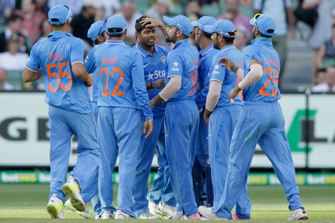 Umesh Yadav is mobbed by his team-mates, Australia v India, 3rd ODI, Melbourne, January 17, 2016