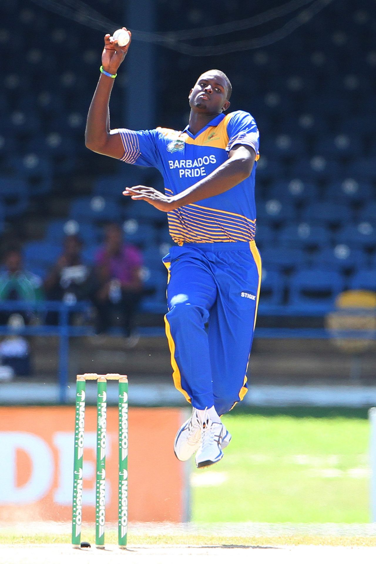 Jason Holder leaps in to deliver at the crease, Barbados v ICC Americas, Nagico Super50 2016, Port-of-Spain, January 13, 2016 
