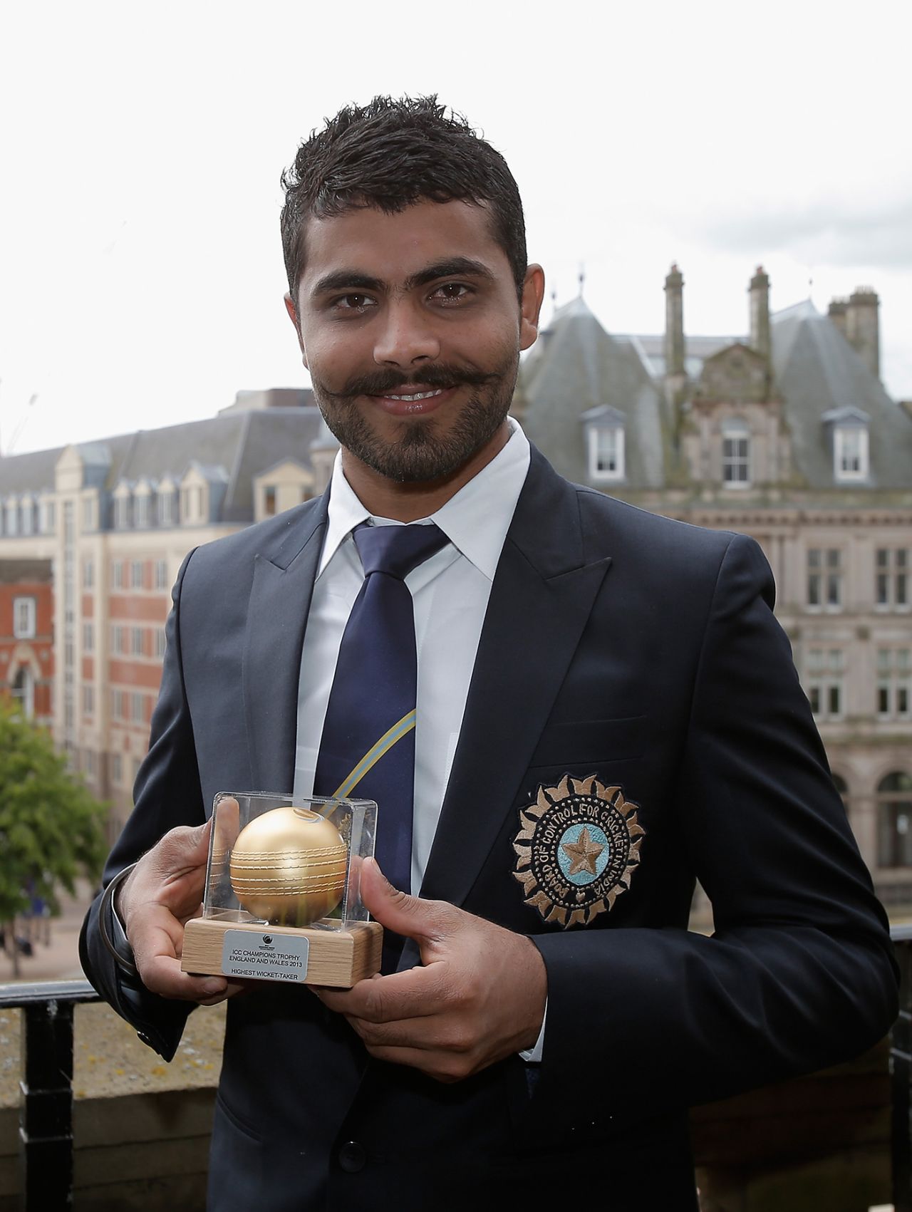 Ravindra Jadeja poses with the trophy awarded to the leading wicket-taker at the end of the tournament, Champions Trophy, Birmingham, June 24, 2013