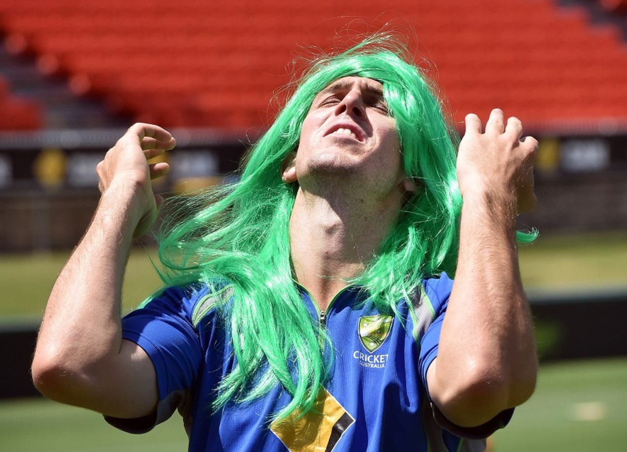 Shaggy green: Mitchell Marsh sports a wig during a practice session, Canberra, January, 16, 2016
