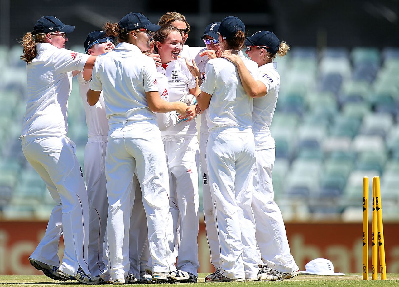 Kate Cross celebrates a wicket with her team-mates, Australia v England, Only women's Test, Perth, 2nd day, January 11, 2014