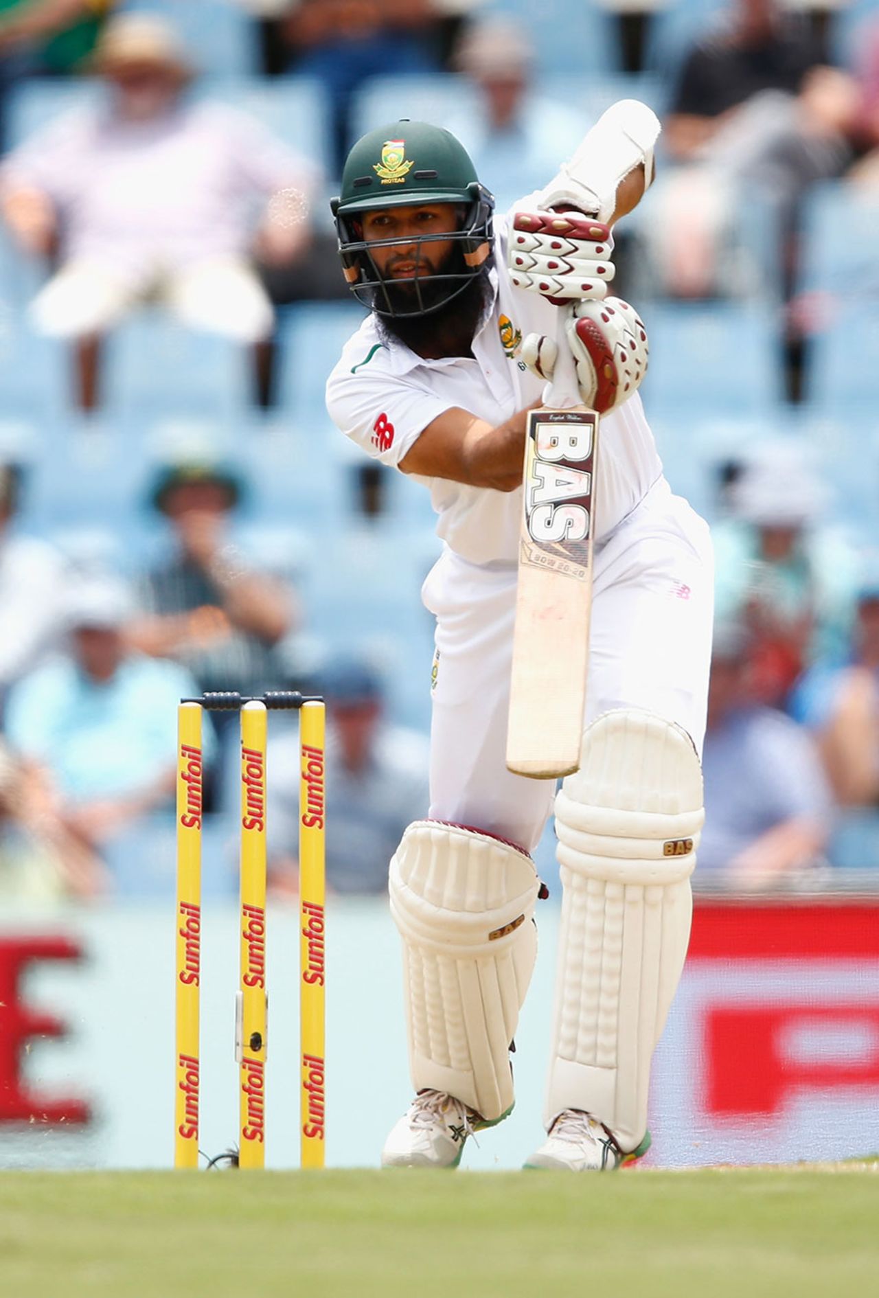 Hashim Amla drives down the ground during his half-century, South Africa v England, 4th Test, Centurion, 1st day, January 22, 2016