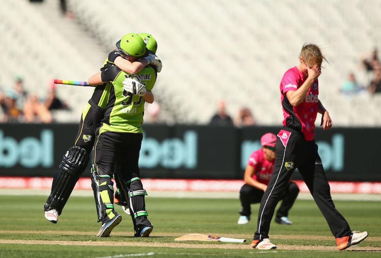 Claire Koski and Lauren Cheatle celebrate victory, as Ellyse Perry is disappointed in defeat, Sydney Sixers v Sydney Thunder, Women's BBL final, Melbourne, January 24, 2016