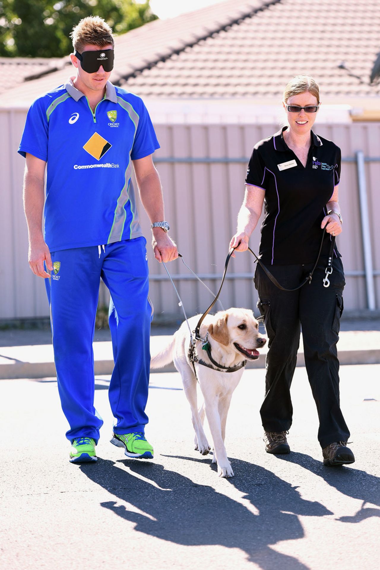 James Faulkner walks with a guide dog, Adelaide, January 25, 2016