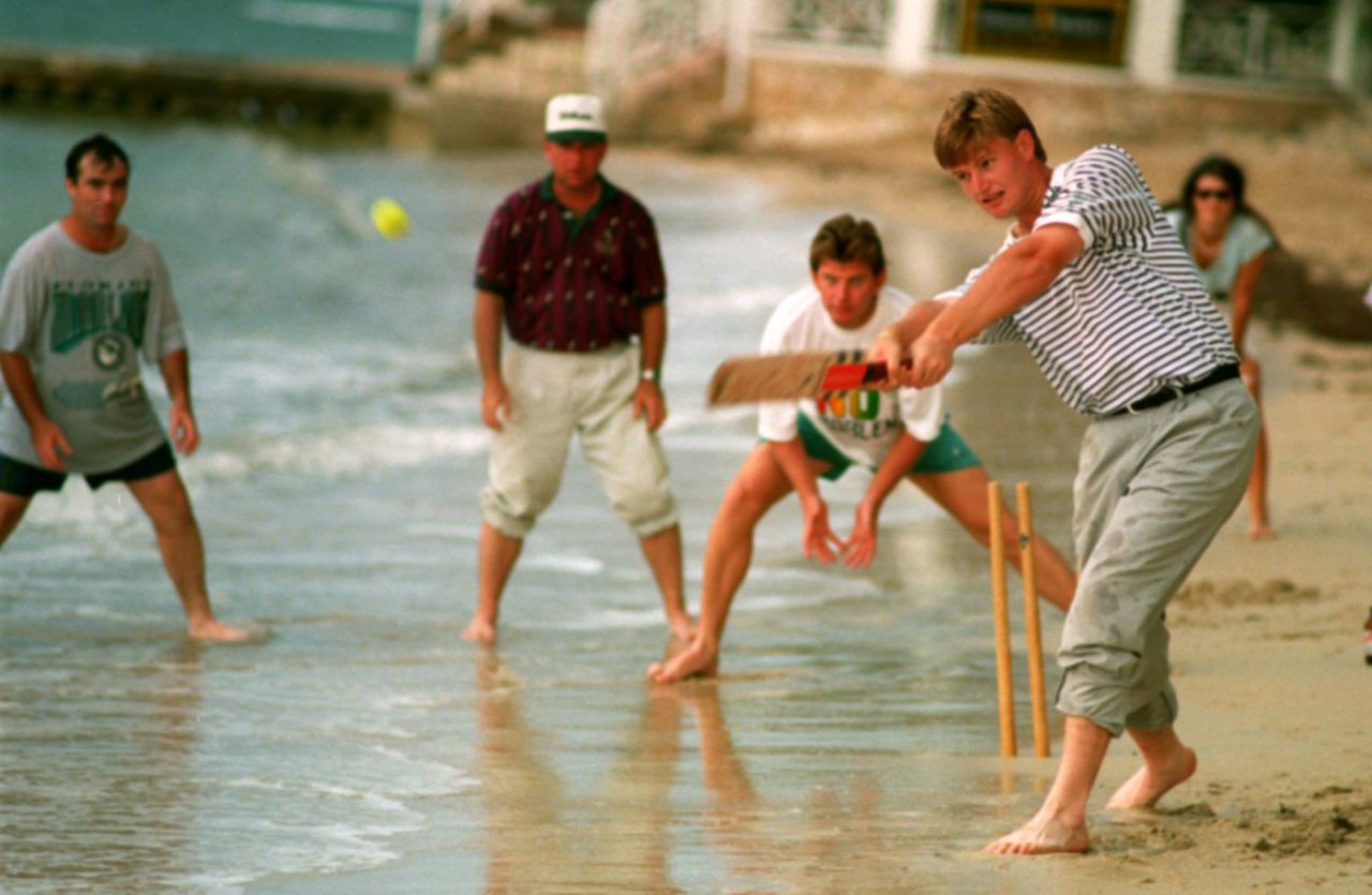 Ernie Els bats in a beach cricket game with other golfers (from left) Craig Parry, Mark McCumber and Nick Price in Jamaica during the Johnnie Walker World Championship, December 16, 1994