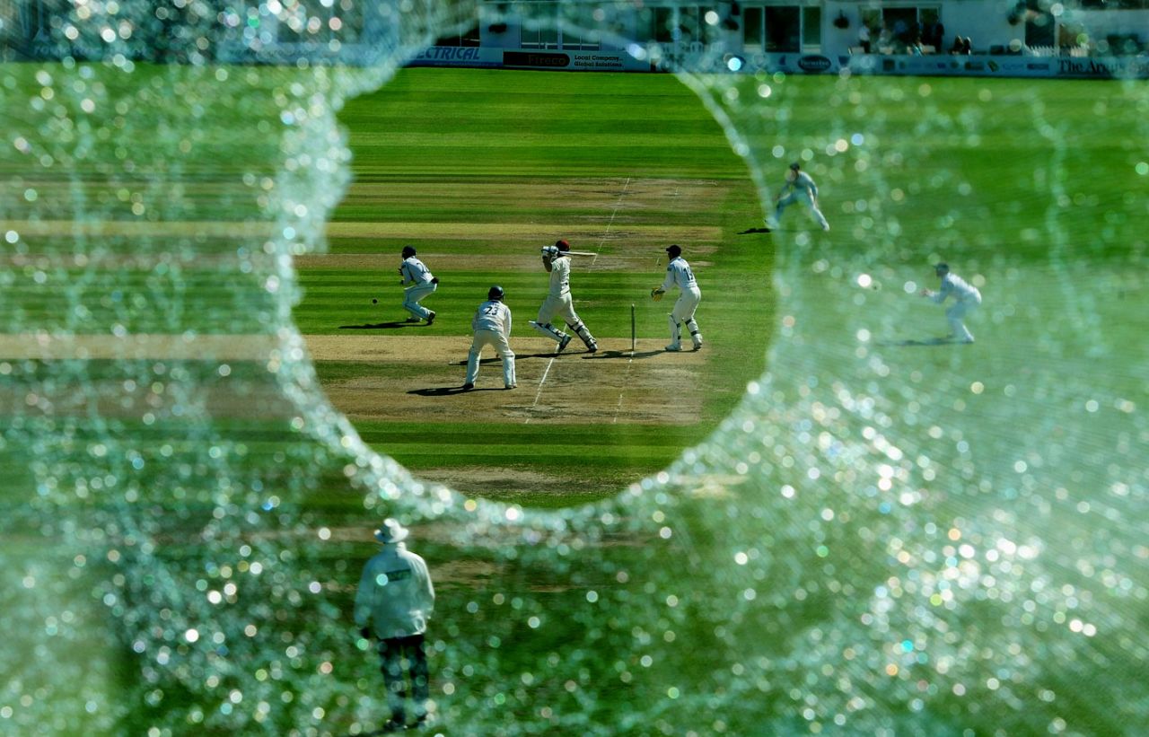 Mal Loye hits a boundary as seen through the hole in the press box window that he created with an earlier six, Sussex v Northamptonshire, County Championship Division Two, Hove, September 9 2010