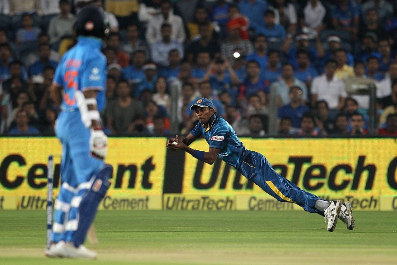Dushmantha Chameera took a sharp catch at mid-off to dismiss Rohit Sharma, India v Sri Lanka, 1st T20, Pune, February 9, 2016