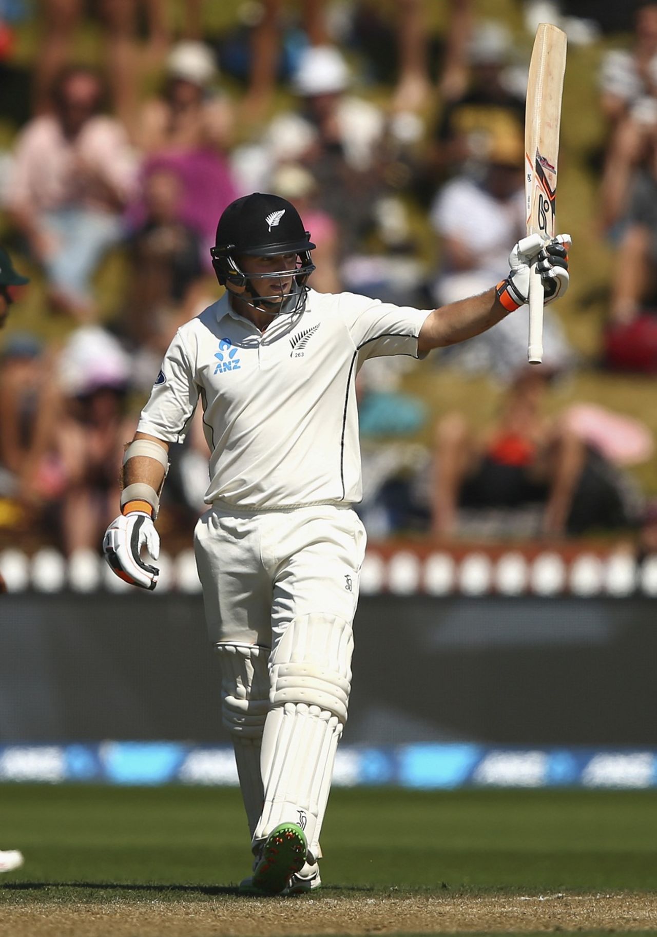 Tom Latham raises his bat after reaching his fifty, New Zealand v Australia, 1st Test, Wellington, 3rd day, February 14, 2016